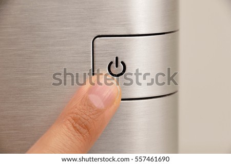 Close up of finger pressing OFF button