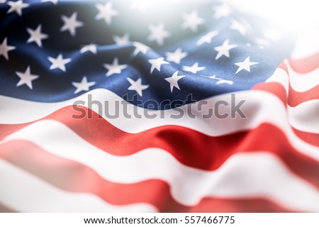 American flag waving in the wind. Royalty-Free Stock Photo #557466775