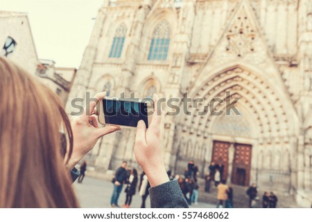 woman is taking pictures with her smartphone at travel location