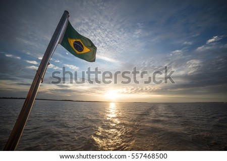 Brazilian flag on a boat Royalty-Free Stock Photo #557468500