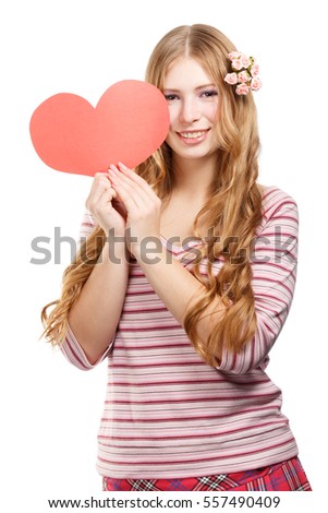 Beautiful young smiling woman with red paper valentine heart isolated on white background.