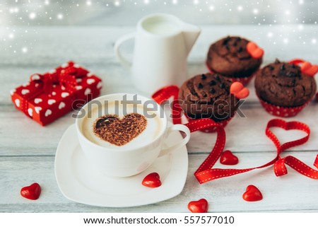 Valentines card and coffee cup with muffins 