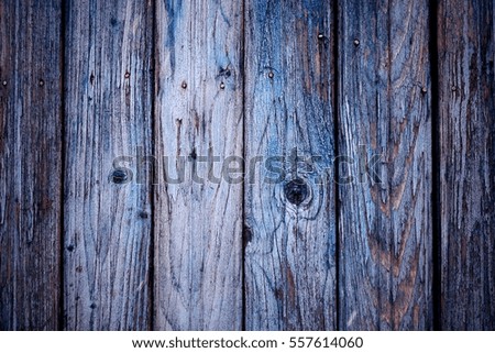 The texture of old wood. Weathered piece of wood. Background of old wood.