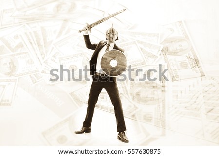 Businessman wearing knight suit prepare to fight for money,fighting for money concept.
Business attack concept.