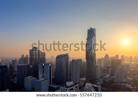 Top view of Bangkok modern office buildings, condominium in  city downtown with sunset sky ,Bangkok is the most populated city in Southeast Asia. 