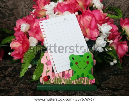 Plain white note paper on flower background