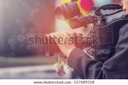 Video camera operator working with his equipment