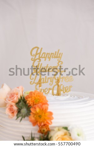 Wedding Cake with Gluten and Dairy Free Sign on it