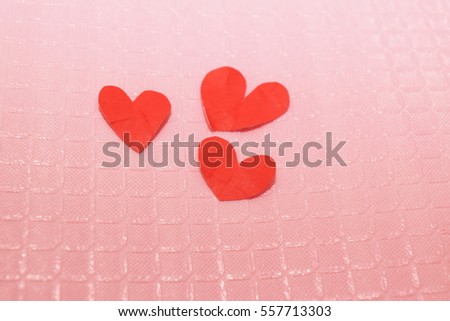Red paper cut into the shape of a heart on Valentine's Day.