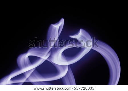 Abstract Magical Light Paint Curving Streak on Black Background