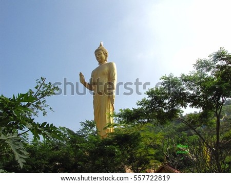 Buddha stand  sky background.