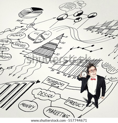 Young businessman holding old alarm clock on sketch background
