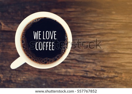 WE LOVE COFFEE. coffee cup concept on wooden background