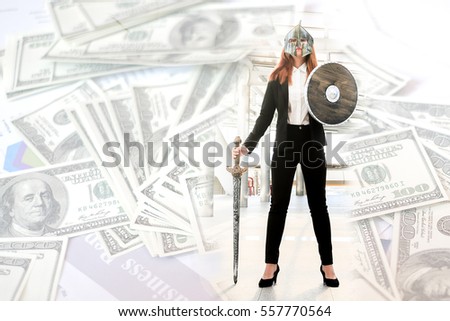 Businesswoman wearing knight suit prepare to fight for money,fighting for money concept.
Business attack concept.