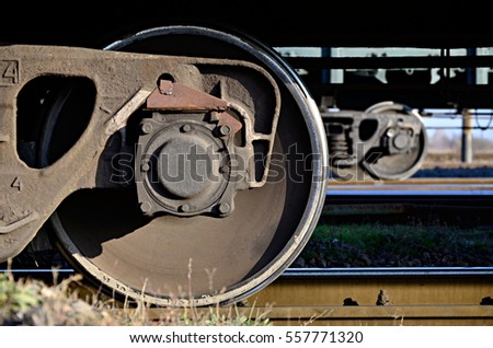 Detailed photo of railway freight car. A fragment of the component parts of the freight car on the railroad in daylight