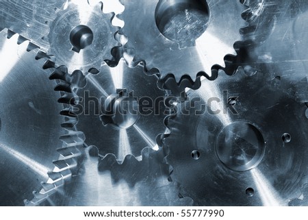 gears and cogs against steel background
