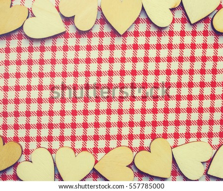 wooden hearts on the pieces of fabric. selective focus. 