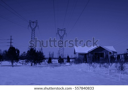 Cabin and pylon in the snow, closeup of photo