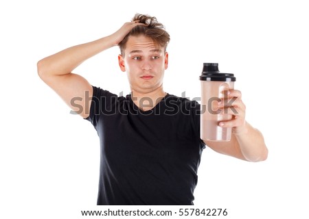 Picture of an attractive young man holding a protein shake