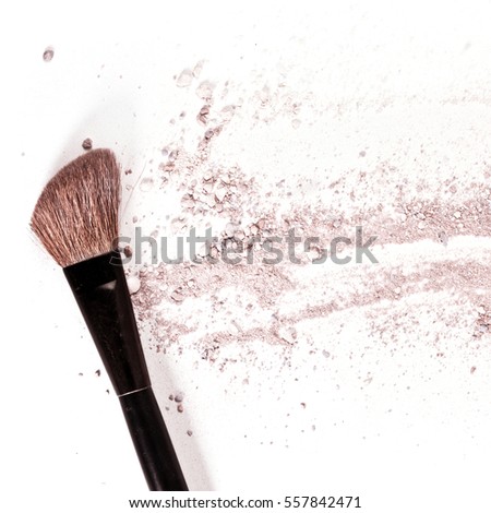 Makeup brush on white background, with traces of powder and blush on it. A square template for a makeup artist's business card or flyer design, with plenty of copyspace