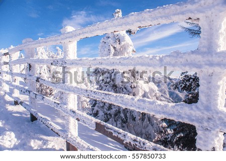 Snowy wooden fence in the mountains