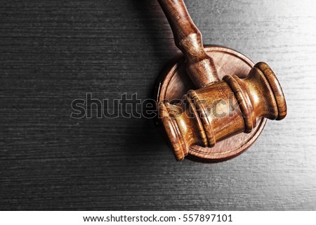 Judge's Gavel over black background Royalty-Free Stock Photo #557897101