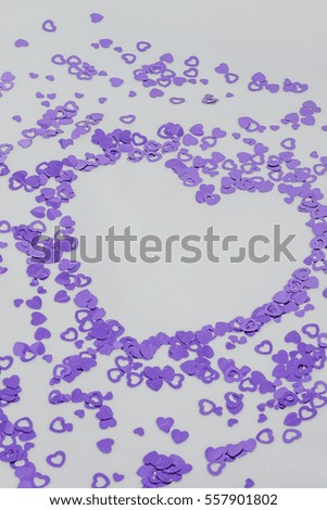 Purple scattering of hearts on a white background