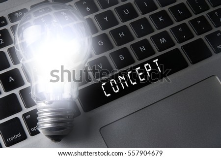 Bulb and black keyboard with innovation and strategic conceptual words. 