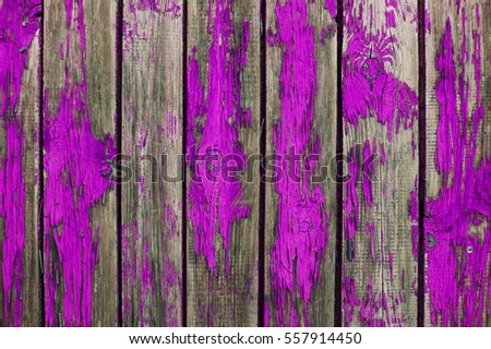 Texture of old wooden fence painted in pink color