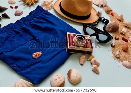 Beach Men Apparel on a seashells and sand background