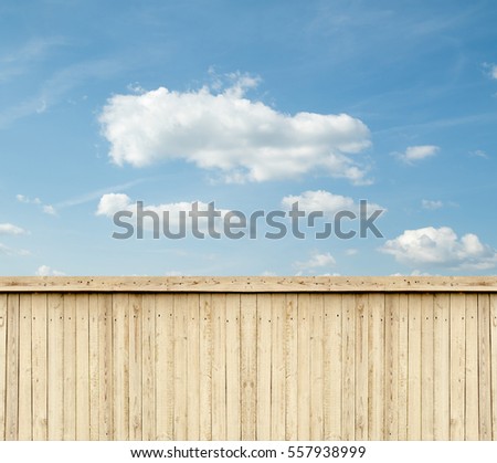 wooden fence sky clouds Royalty-Free Stock Photo #557938999
