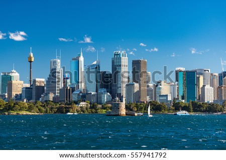 Sydney cityscape of Sydney CBD with ferries and yachts over Sydney Harbour