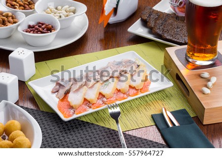 Assortment of fish slices. Beer snack on restaurant table.