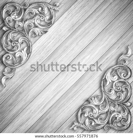 Pattern of wood carve flower on gray wood background