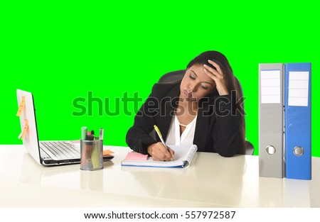 young beautiful latin business woman suffering stress working at office computer desk looking worried and desperate having problem at work isolated green chroma key background