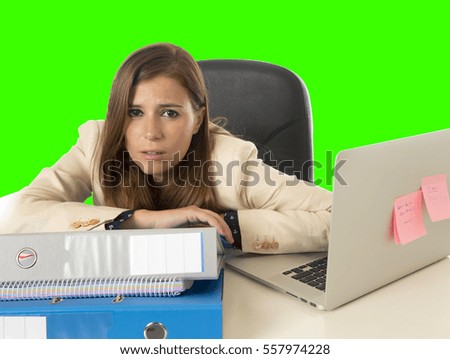 attractive sad desperate business woman suffering stress and headache at office laptop computer desk depressed and overwhelmed isolated green chroma key screen background