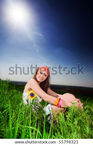 Long-haired girl on grass