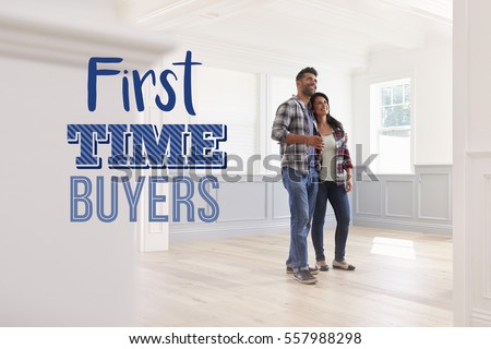 First Time Buyers Couple In Their New Home Royalty-Free Stock Photo #557988298