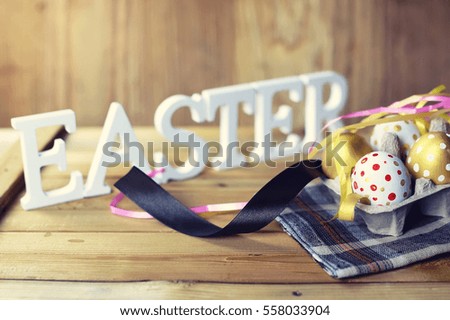 Easter composition flower and eggs on wooden background