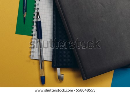 Children's school supplies in the chaos on the table