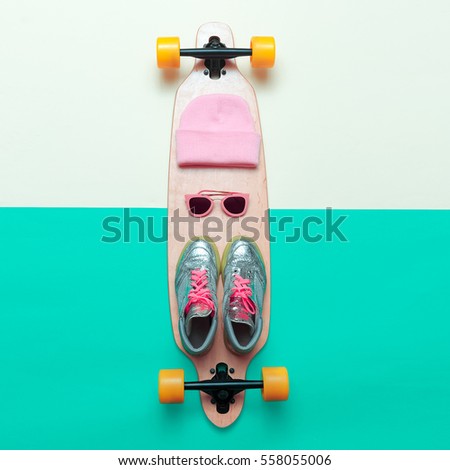 Girls love skateboard. Set skateboarder. Stylish active life. Sneakers, sunglasses, skateboard, beanie Pink Vibration
