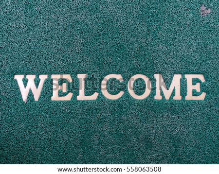 Welcome wording on green capet