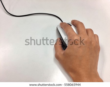 Close-up of women hand clicking mouse.