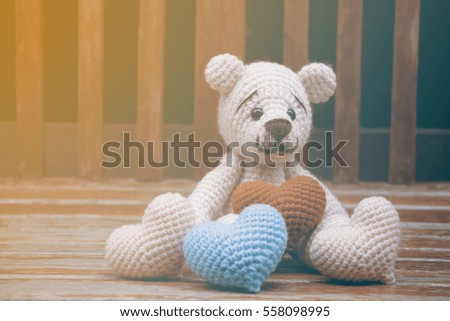 crochet bear and heart crochet foreground.