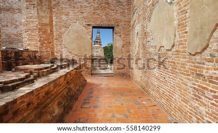 ancient brick window with nature and old brick temple outside view in historical temple