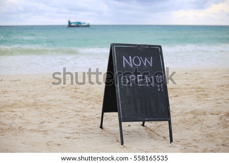 Blackboard on beach