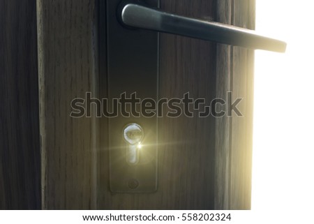 Door lock covered with frost with in front of sunlight