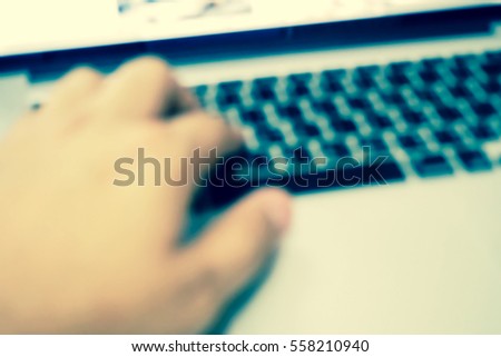 Picture blurred  for background abstract and can be illustration to article of hand on keyboard close up