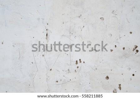 Old cement wall texture. Old ragged plaster white