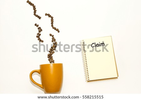 Coffee cup, coffee beans, book and text on white backgound